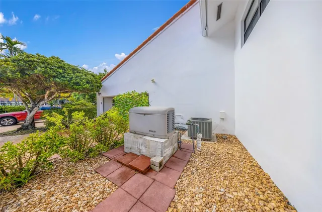 a view of a house with swimming pool and a yard