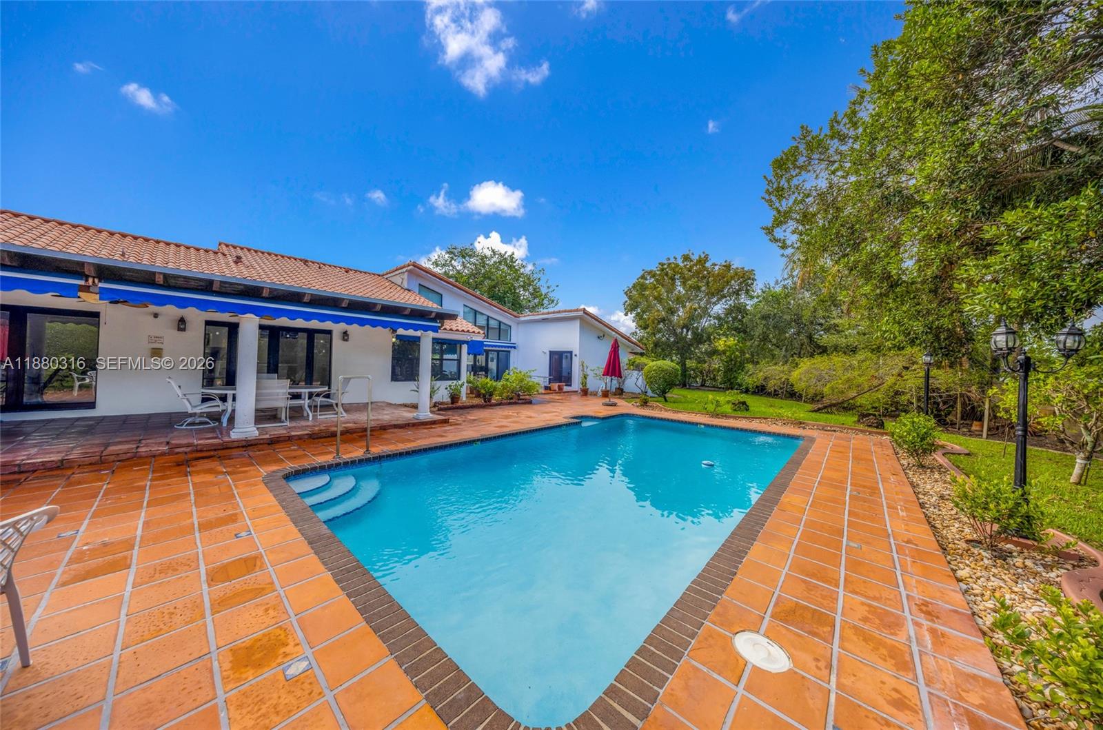 10204 Southwest 96th Court Miami, FL 33176 - Photo 39 of 54 a view of swimming pool with lounge chair