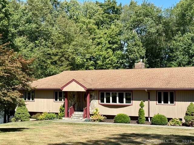 a house with trees in the background