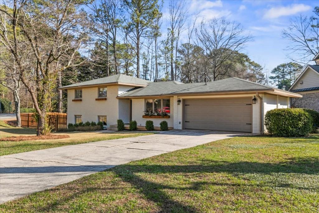 2902 Lavista Court Decatur, GA 30033 - Photo 1 of 1 a front view of a house with a yard and garage