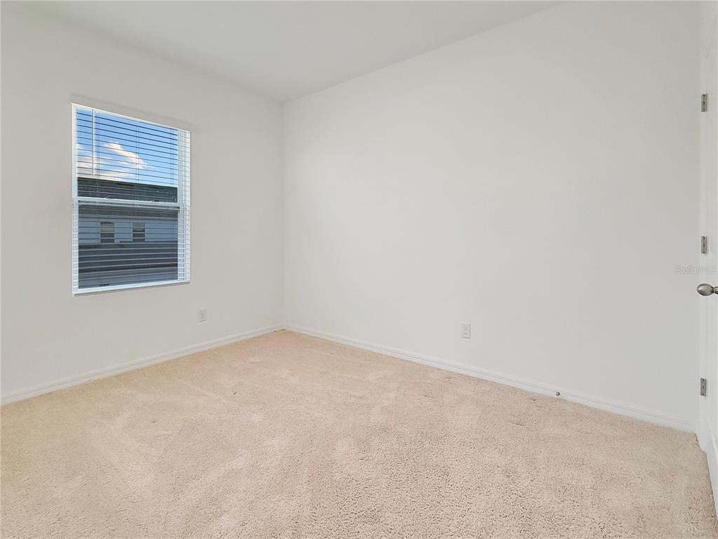 6502 Rover Way St. Cloud, FL 34771 - Photo 8 of 9 an empty room with a window