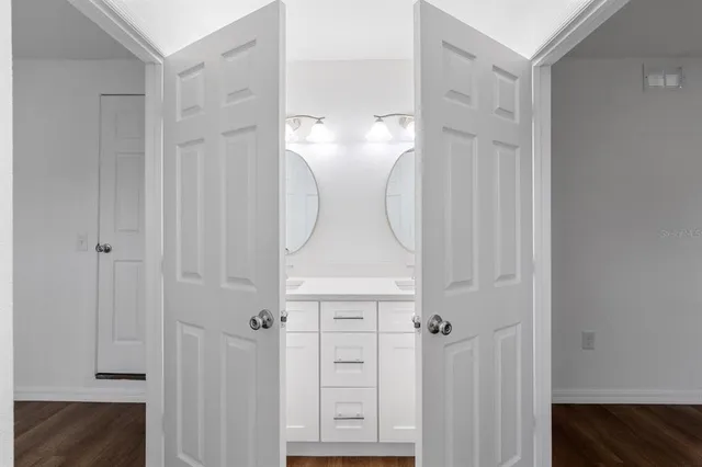 a view of a bathroom with closet area