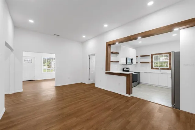 a view of kitchen with wooden floor