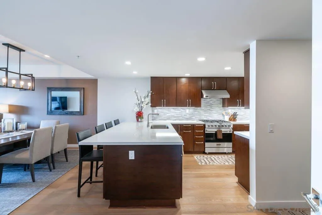 6767 Neptune Place, Unit 301 La Jolla, CA 92037 - Photo 21 of 39 a view of a dining room with furniture