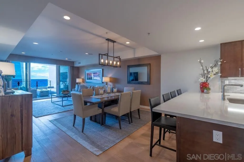 6767 Neptune Place, Unit 301 La Jolla, CA 92037 - Photo 24 of 39 a view of a dining room with furniture
