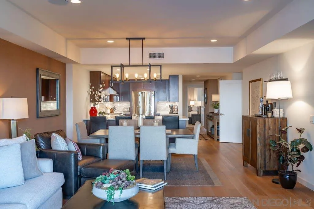 6767 Neptune Place, Unit 301 La Jolla, CA 92037 - Photo 26 of 39 a living room with furniture and a chandelier