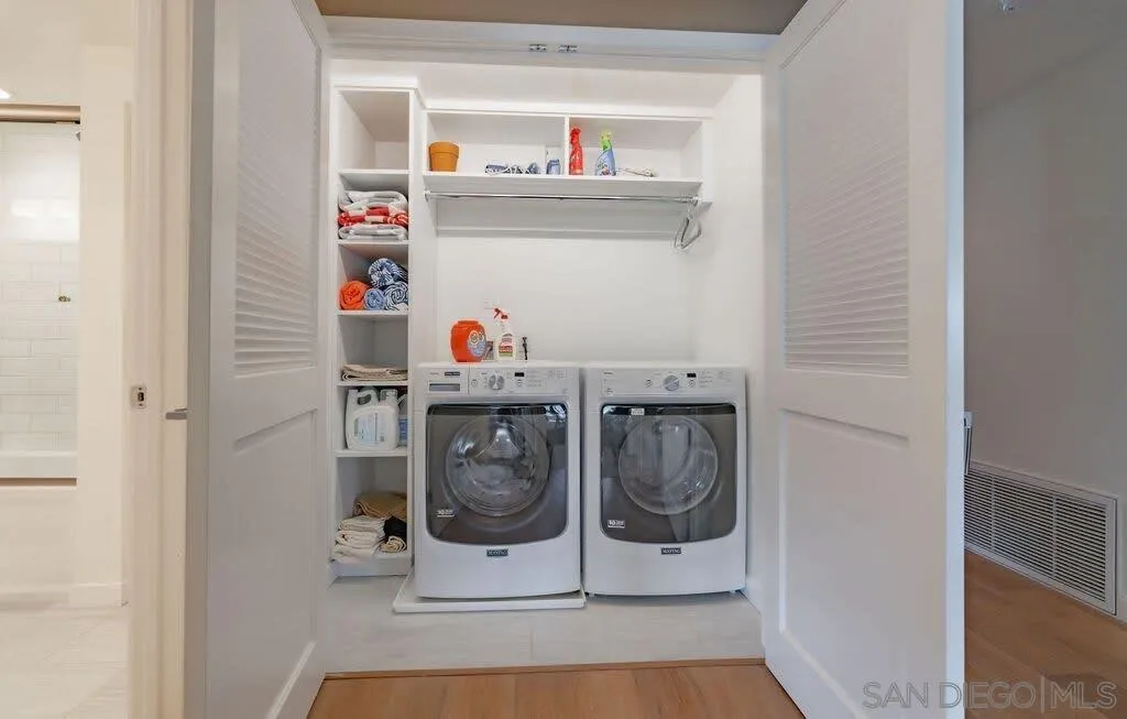 6767 Neptune Place, Unit 301 La Jolla, CA 92037 - Photo 27 of 39 a utility room with dryer and washer