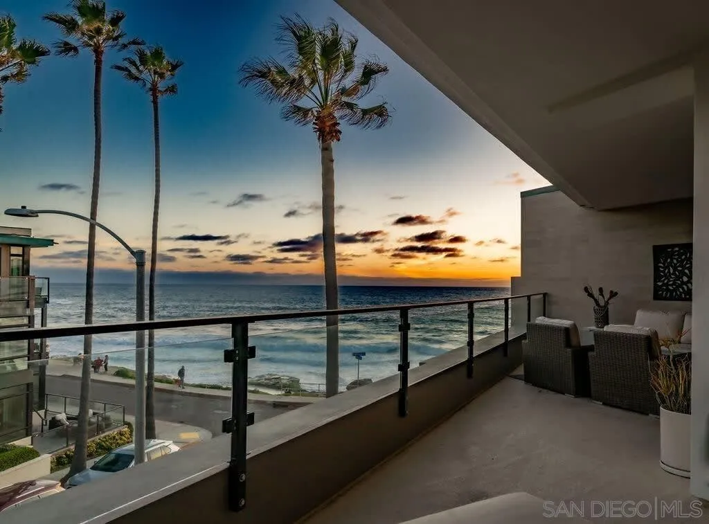 6767 Neptune Place, Unit 301 La Jolla, CA 92037 - Photo 34 of 39 a view of a balcony with couches and wooden floor