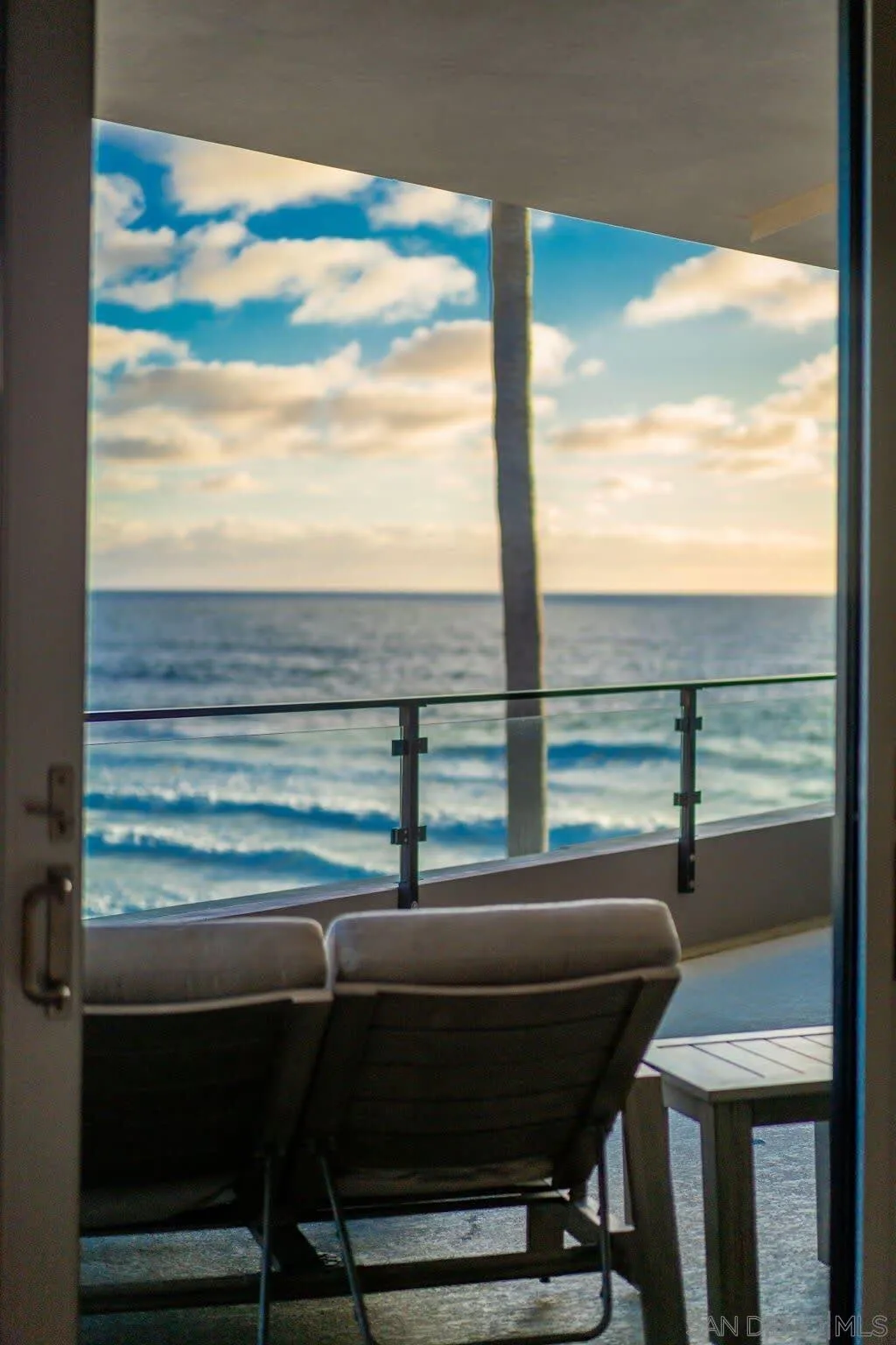 6767 Neptune Place, Unit 301 La Jolla, CA 92037 - Photo 38 of 39 a balcony with table and chairs