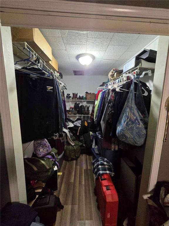 105 Memphis Lane Hartwell, GA 30643 - Photo 17 of 20 a view of walk in closet with clothes and shoes