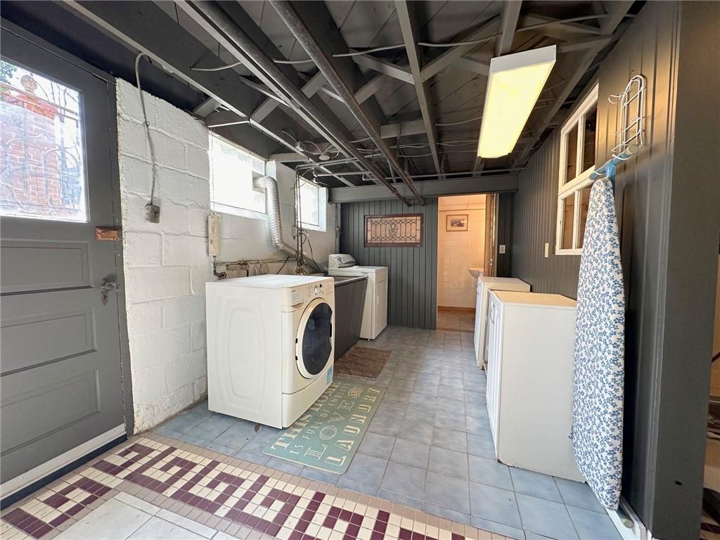 5515 Richland Road Gibsonia, PA 15044 - Photo 41 of 46 The 15’x8’ Laundry is on the lower level next to the walk out to the side yard. The flooring is ceramic, all walls were just painted, and the ceiling, too! No cobwebs, ??))). The washer and dryer stay the washer is about 8 yrs old, the dryer older, but works! The far room is a Powder room, the shower for two is on the other side of this right wall.