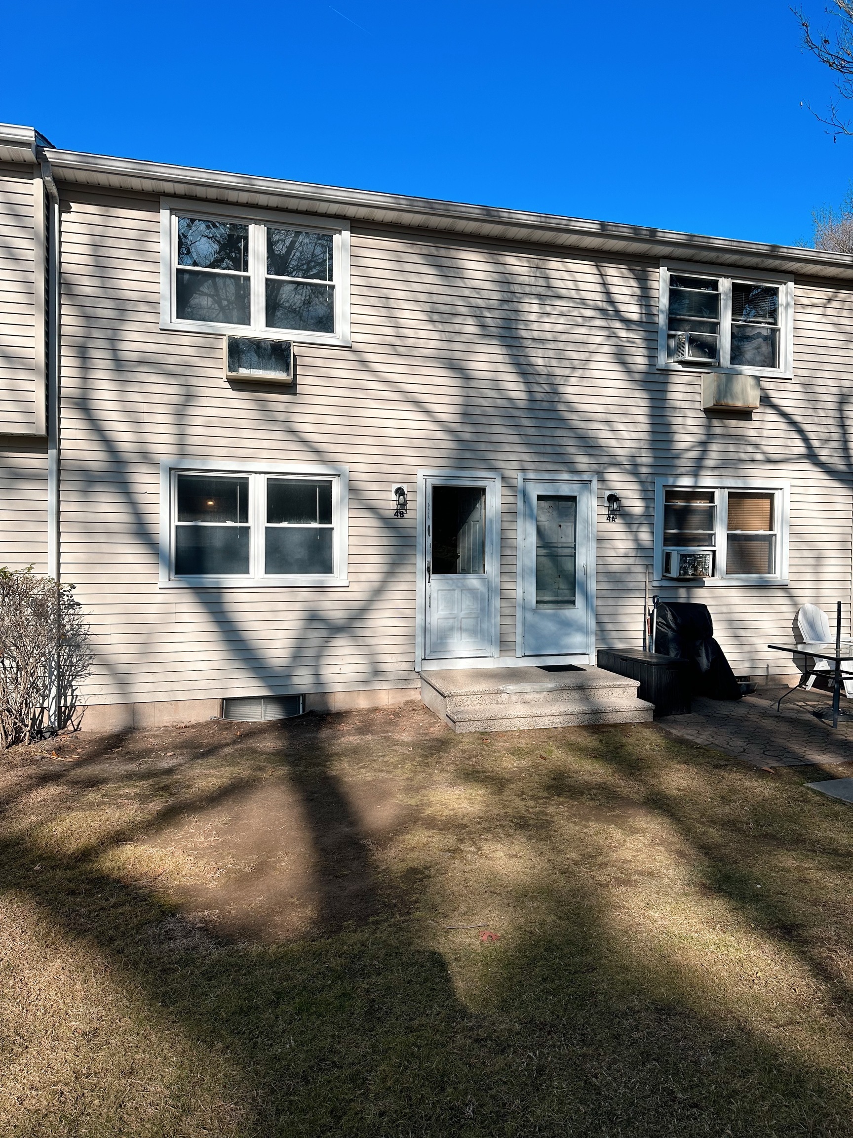 1081 New Haven Road, Unit 4B Naugatuck, CT 06770 - Photo 8 of 18 a front view of a house with a yard