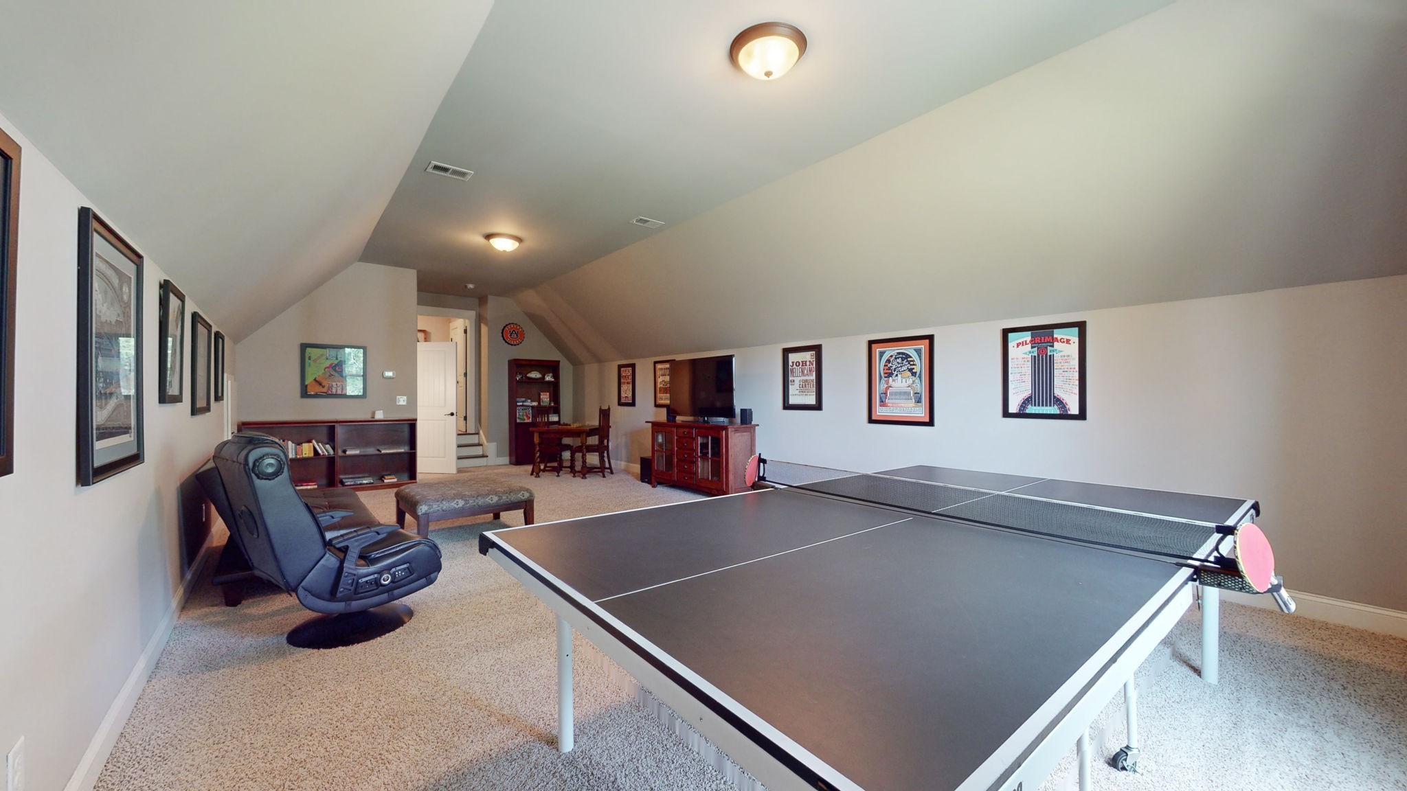 2667 Sporting Hill Bridge Road Thompson's Station, TN 37179 - Photo 28 of 42 a living room with lots of furniture and gym equipment