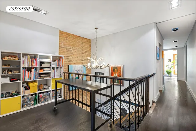 a vase of flowers sitting on a floor