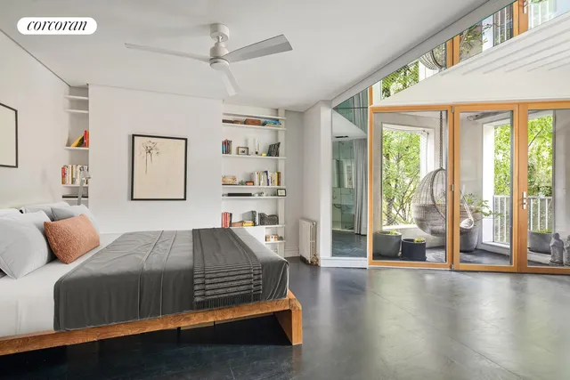 a view of a patio with table and chairs and potted plants