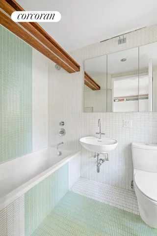 a bathroom with a shower and a sink