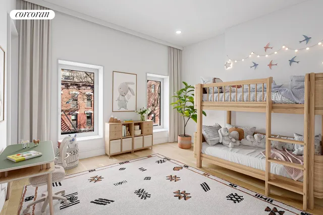 a spacious bedroom with a bed and a window