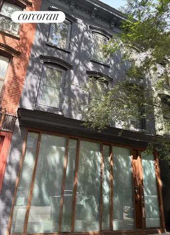 a view of a swimming pool with outdoor seating and plants