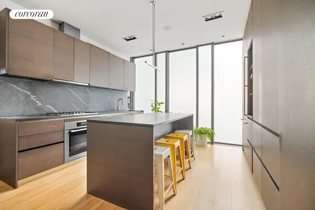 a view of a dining room with furniture wooden floor and a chandelier