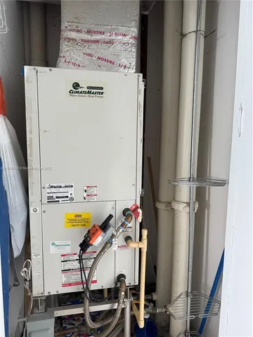 a view of storage and utility room with washer and dryer