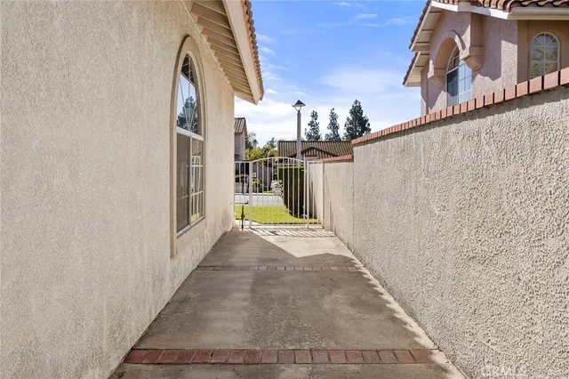 a view of a house with a window and brick walls