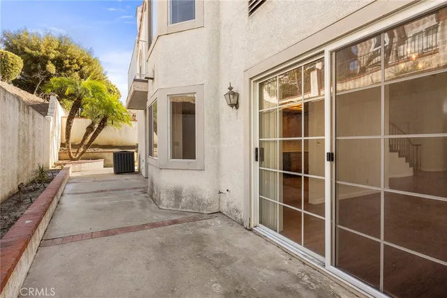 a bathroom with a granite countertop sink toilet a large mirror a bathtub and shower