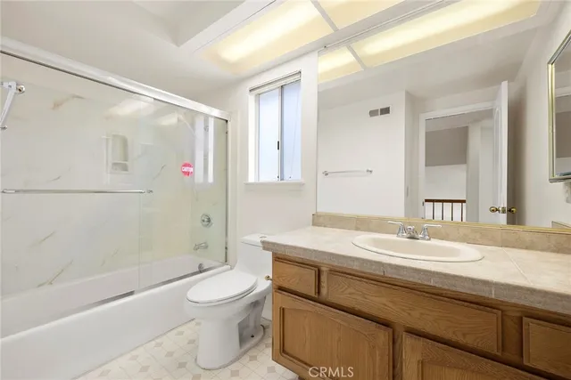 a view of an empty room and a window