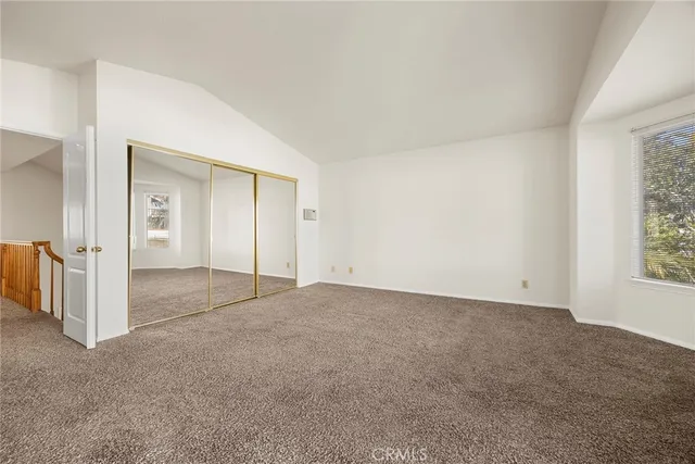 a view of an empty room with a glass door