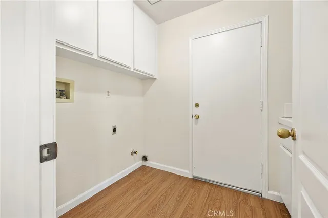a view of an entryway with wooden floor