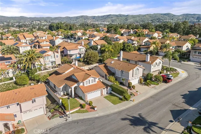 an aerial view of a house with a garden