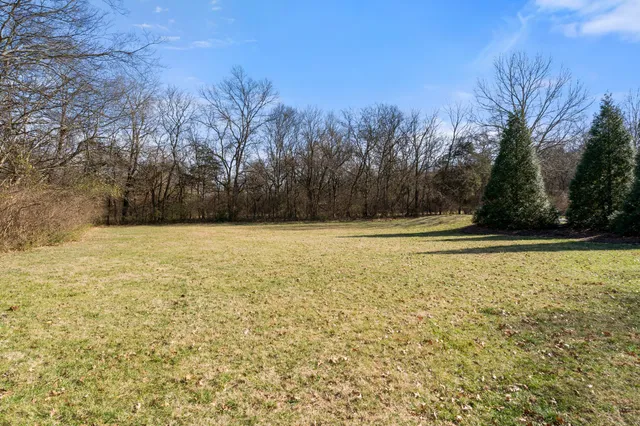 a view of a swimming pool with an outdoor space and seating area