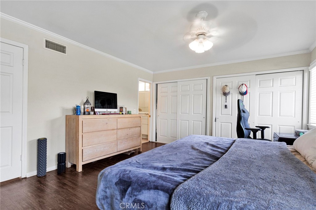 1087 Baseline Road La Verne, CA 91750 - Photo 23 of 39 a bedroom with a bed and a flat tv screen on dresser