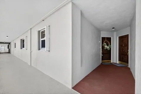a view of a hallway with an empty room