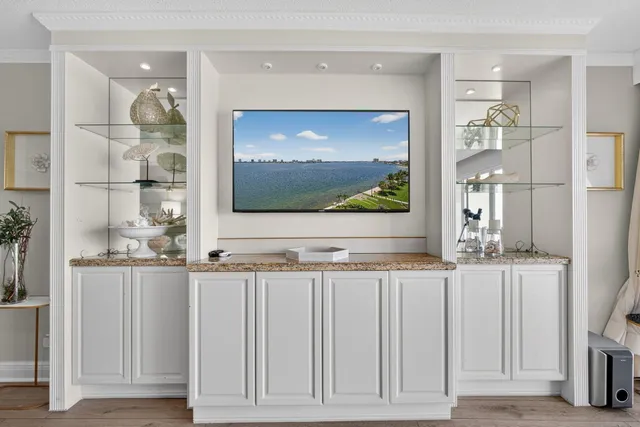 a view of living room with a flat screen tv and floor to ceiling window