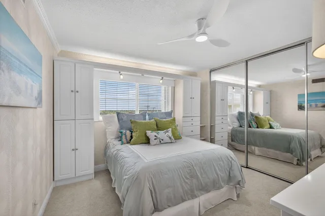 a bedroom with a bed and a mirror