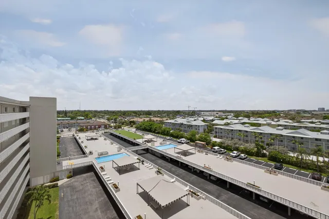 a view of a patio with a table and chairs