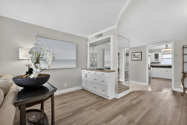 a room with furniture and wooden floor