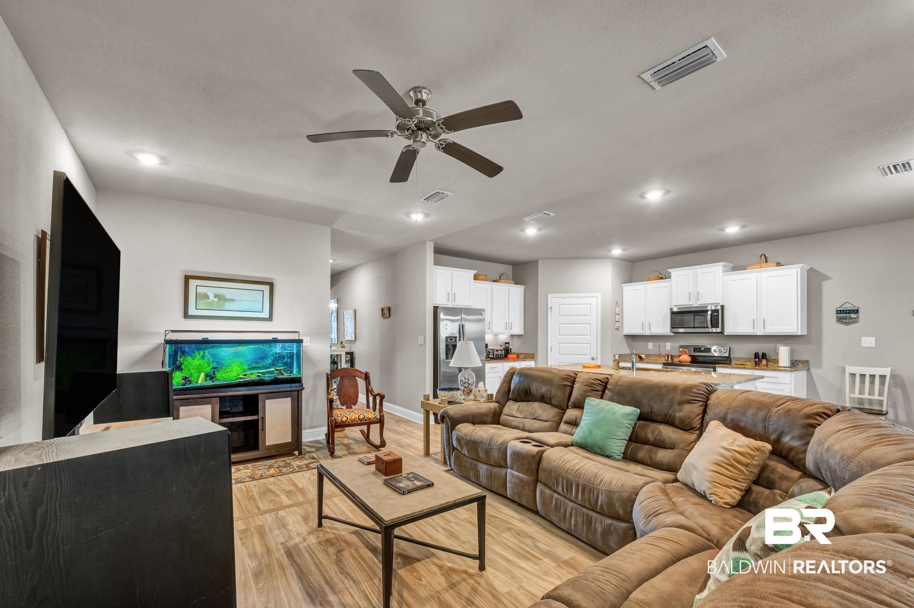 24655 Slater Mill Road Daphne, AL 36526 - Photo 9 of 36 Living area with ceiling fan, light wood finished floors, recessed lighting, and baseboards