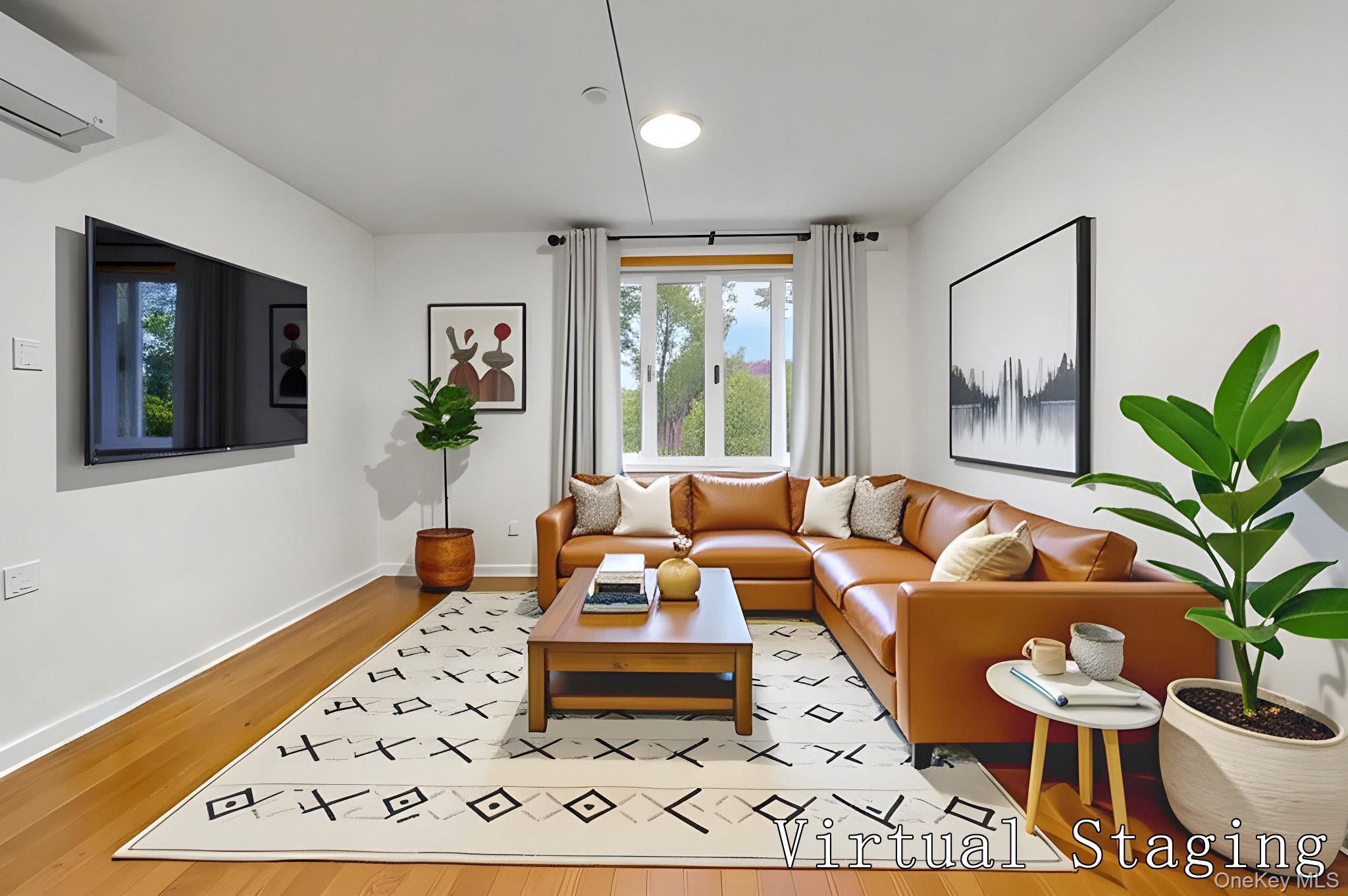 58-04 Main Street, Unit 1A Queens, NY 11355 - Photo 1 of 13 Living area featuring a wall mounted air conditioner and light wood finished floors