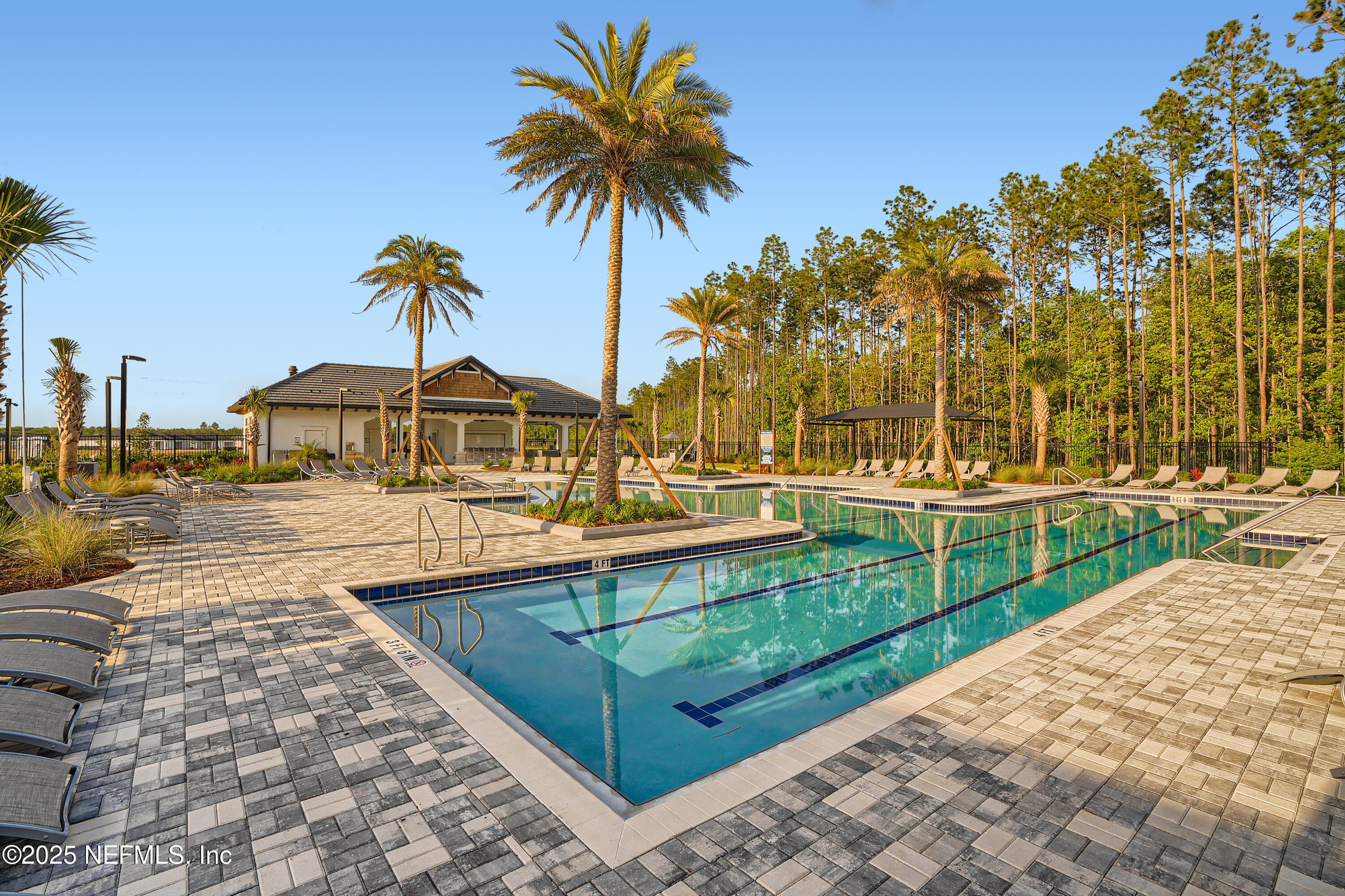 100 Round Robin Run St. Johns, FL 32259 - Photo 22 of 40 a view of a swimming pool with a garden