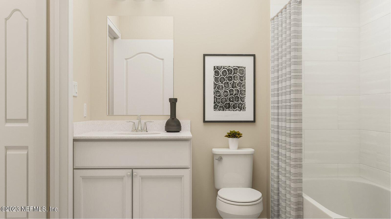 100 Round Robin Run St. Johns, FL 32259 - Photo 27 of 40 a bathroom with a granite countertop sink toilet and a mirror