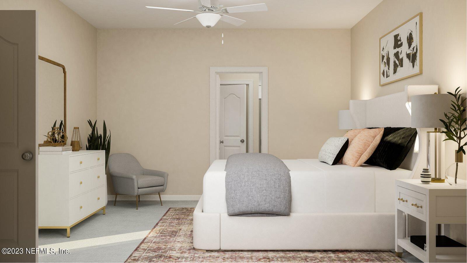 100 Round Robin Run St. Johns, FL 32259 - Photo 34 of 40 a bedroom with a bed and a couch