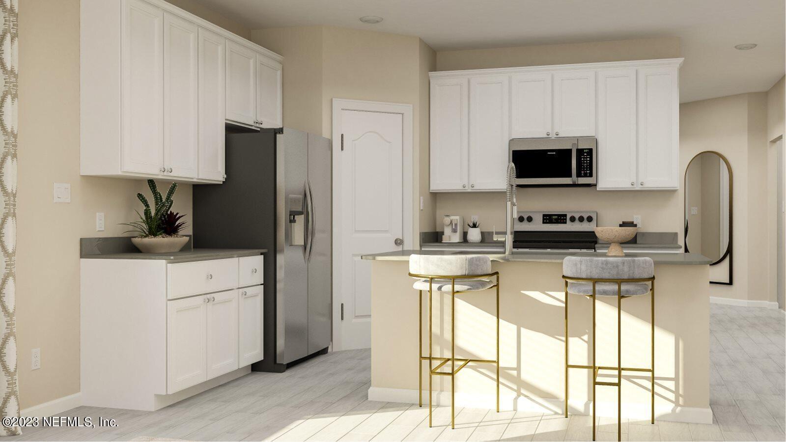 100 Round Robin Run St. Johns, FL 32259 - Photo 39 of 40 a kitchen with stainless steel appliances a stove a sink and a refrigerator