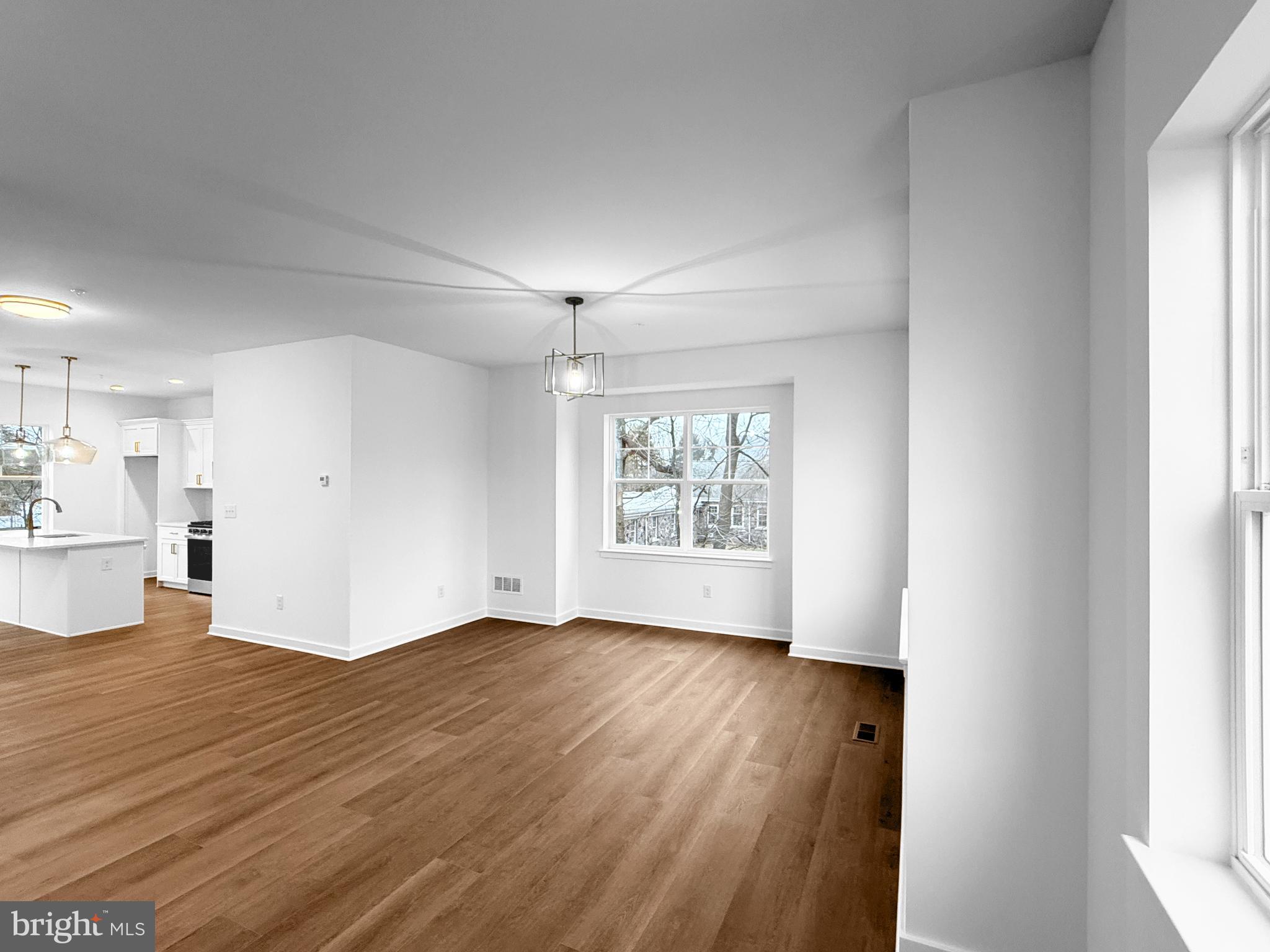 9 East Butler Avenue New Britain, PA 18901 - Photo 17 of 36 a view of an empty room with wooden floor and a window