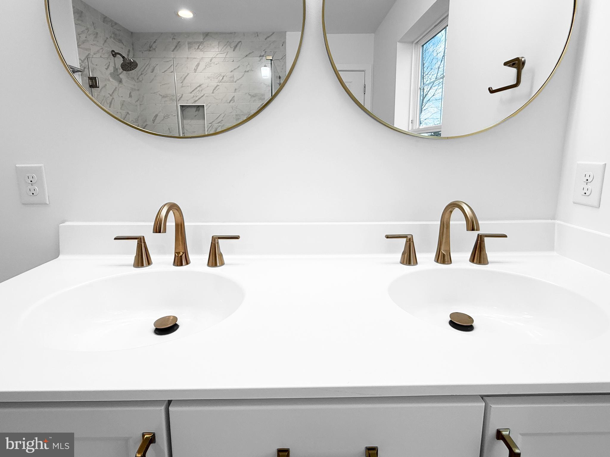 9 East Butler Avenue New Britain, PA 18901 - Photo 26 of 36 a bathroom with a sink and a mirror