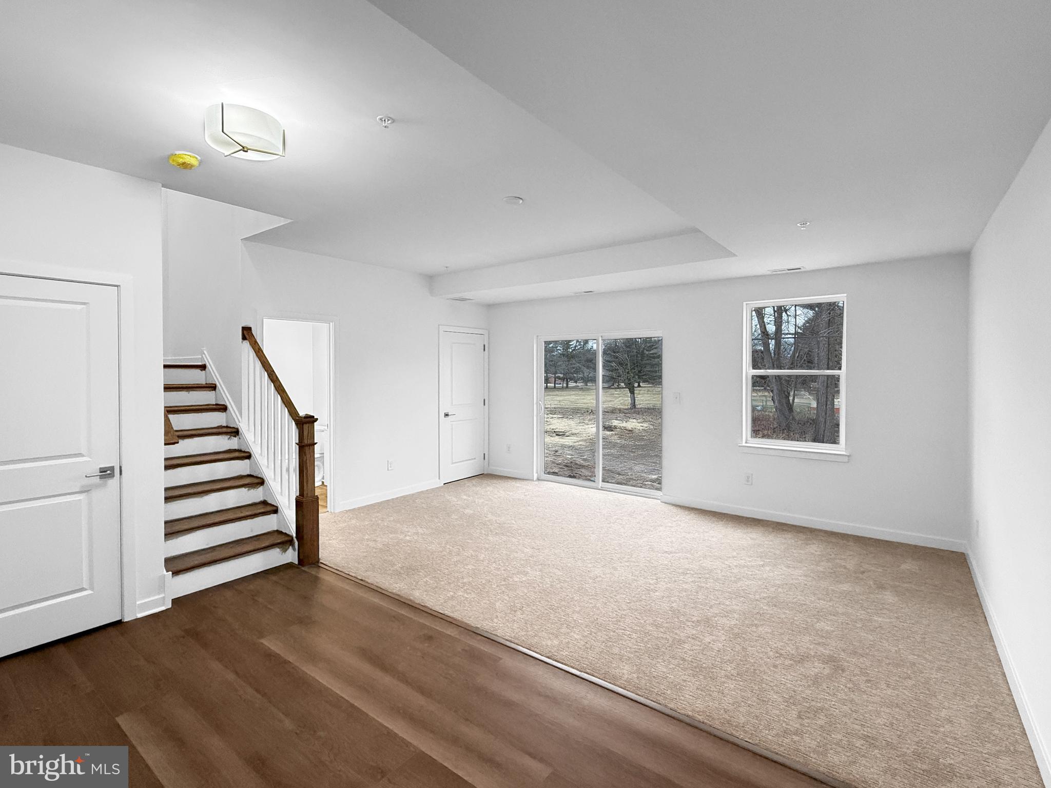 9 East Butler Avenue New Britain, PA 18901 - Photo 4 of 36 a view of an empty room with wooden floor and a window