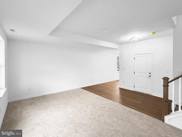 an empty room with wooden floor