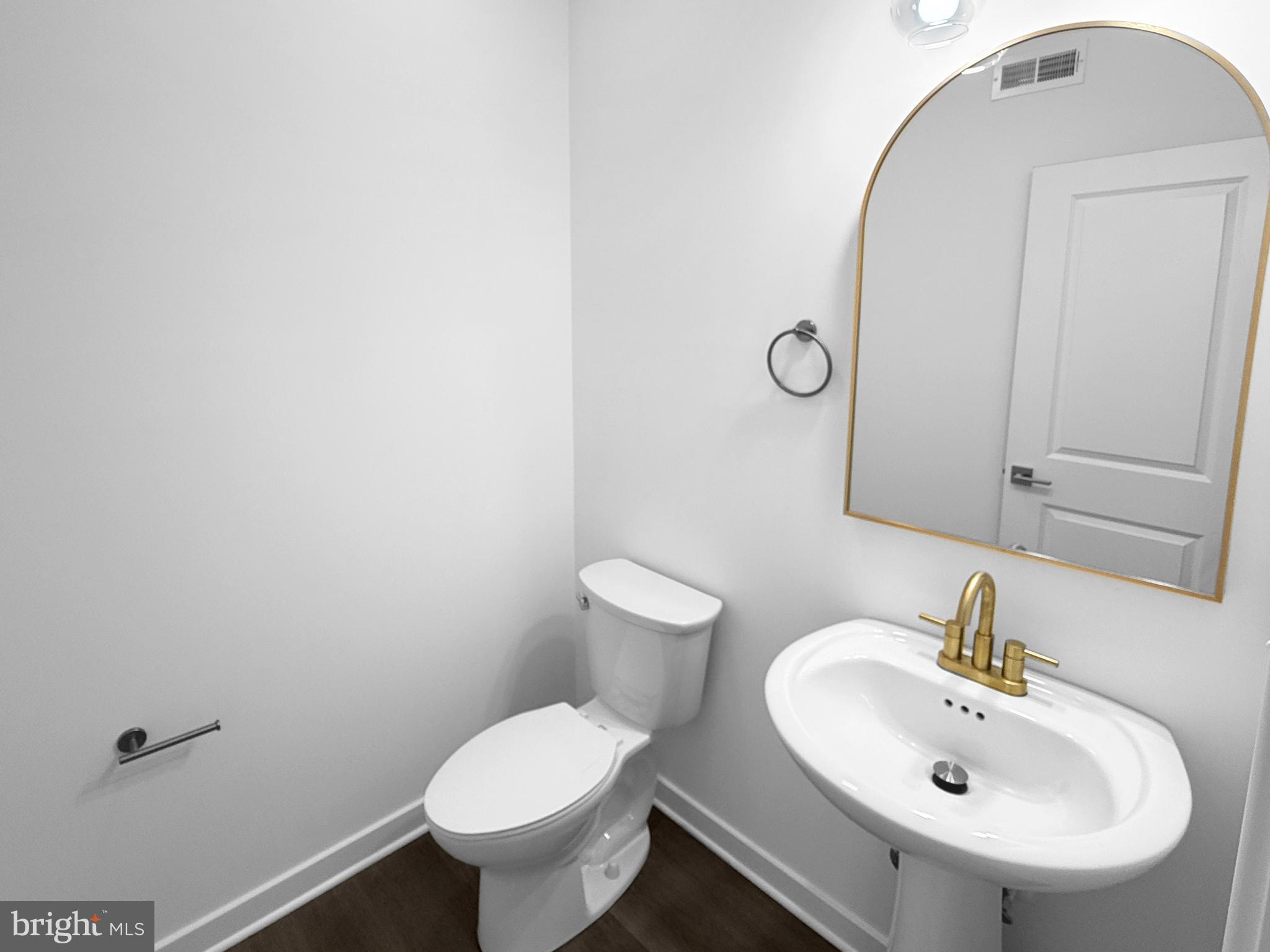 9 East Butler Avenue New Britain, PA 18901 - Photo 6 of 36 a bathroom with a toilet sink and mirror