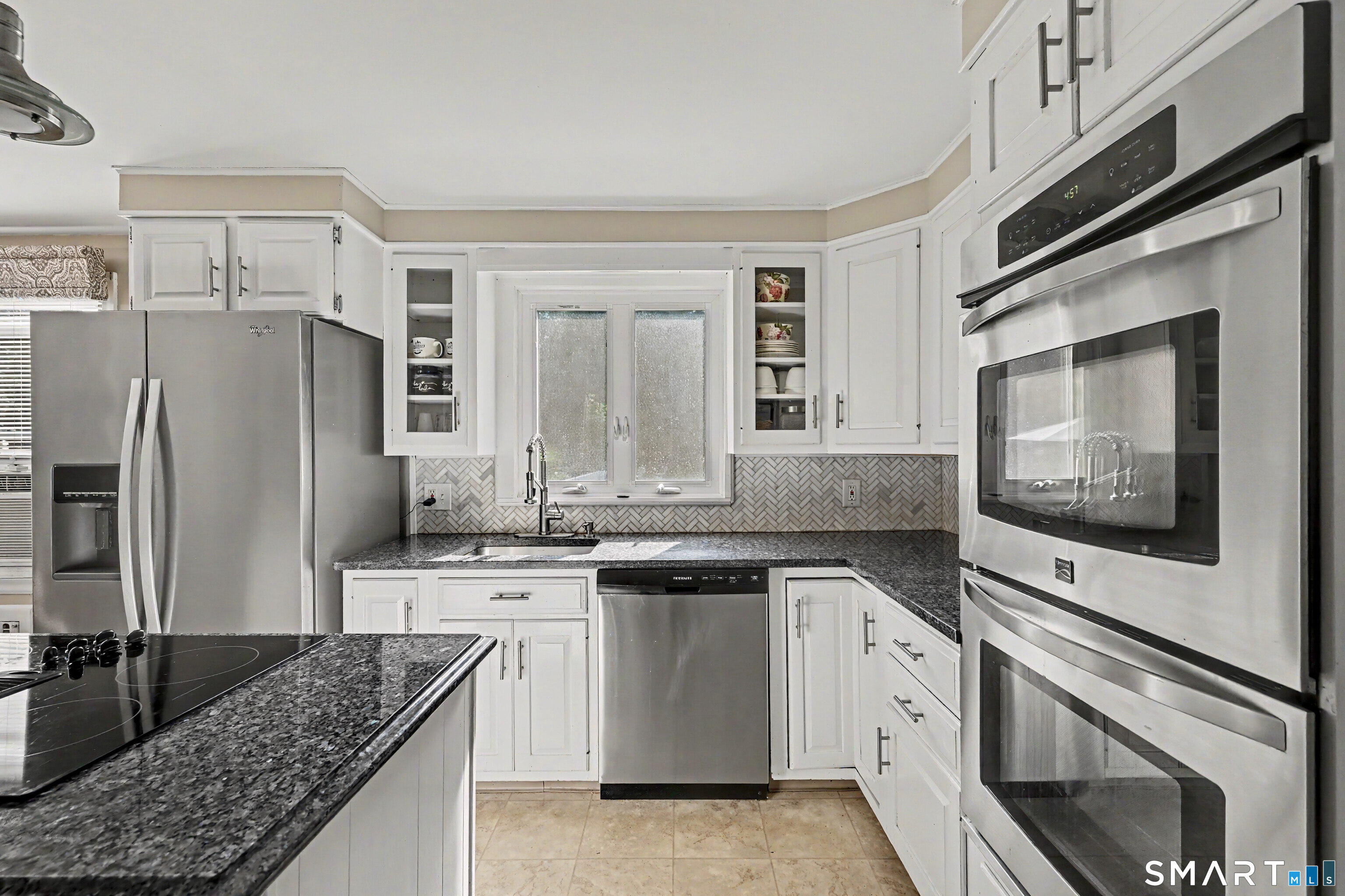 524 Ferry Road Orange, CT 06477 - Photo 10 of 40 a kitchen with stainless steel appliances granite countertop a sink stove and refrigerator
