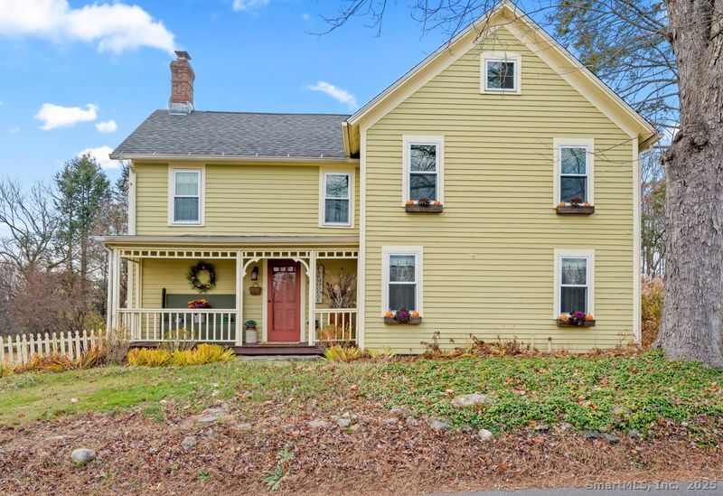 a view of a house with a yard and plants